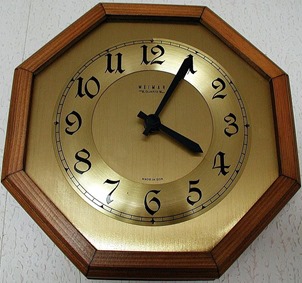 a clock with a gold face