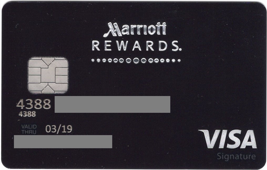 a black and silver card with a chip