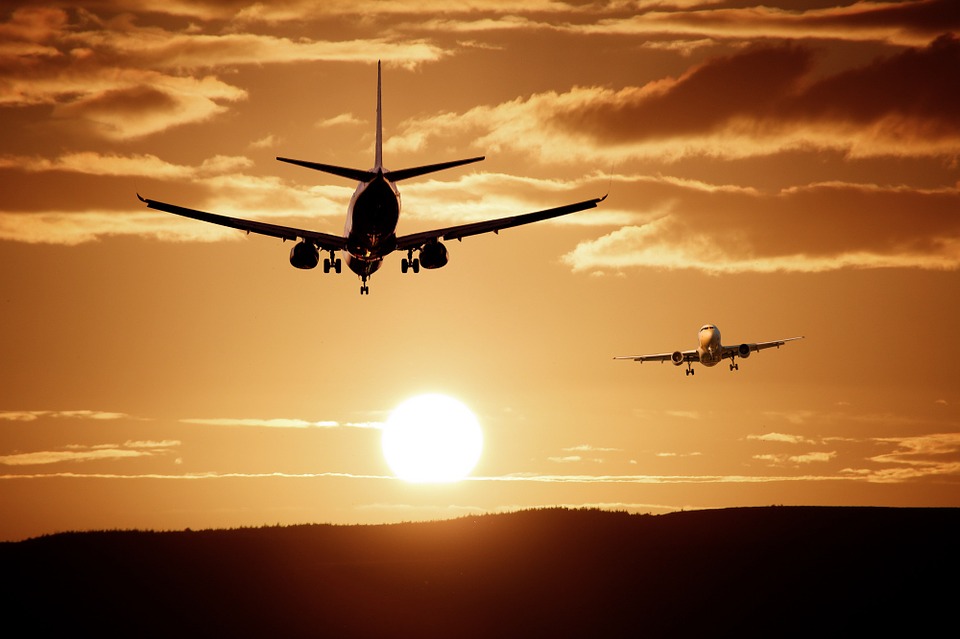 two airplanes flying in the sky