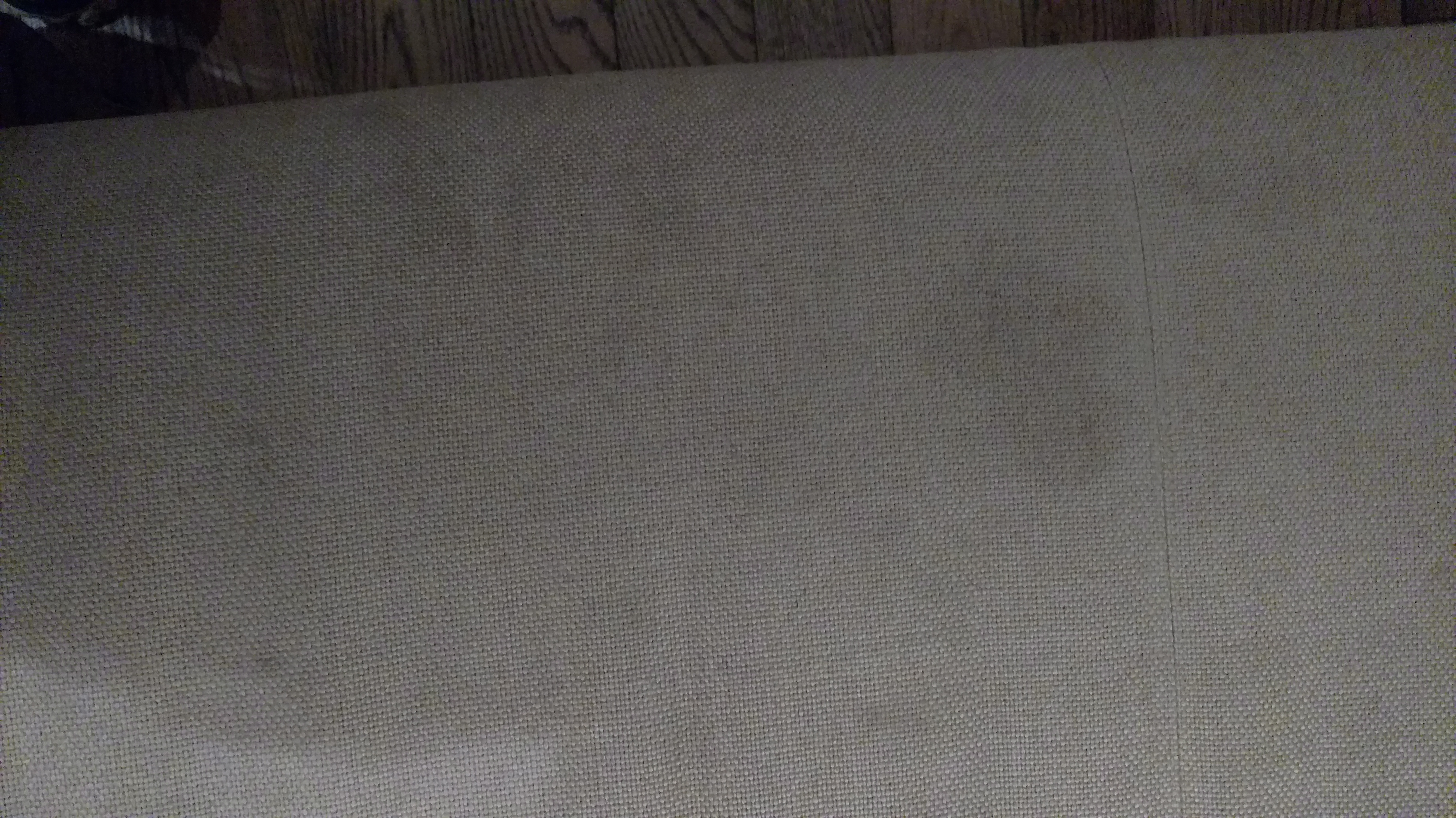 a white fabric on a wooden floor