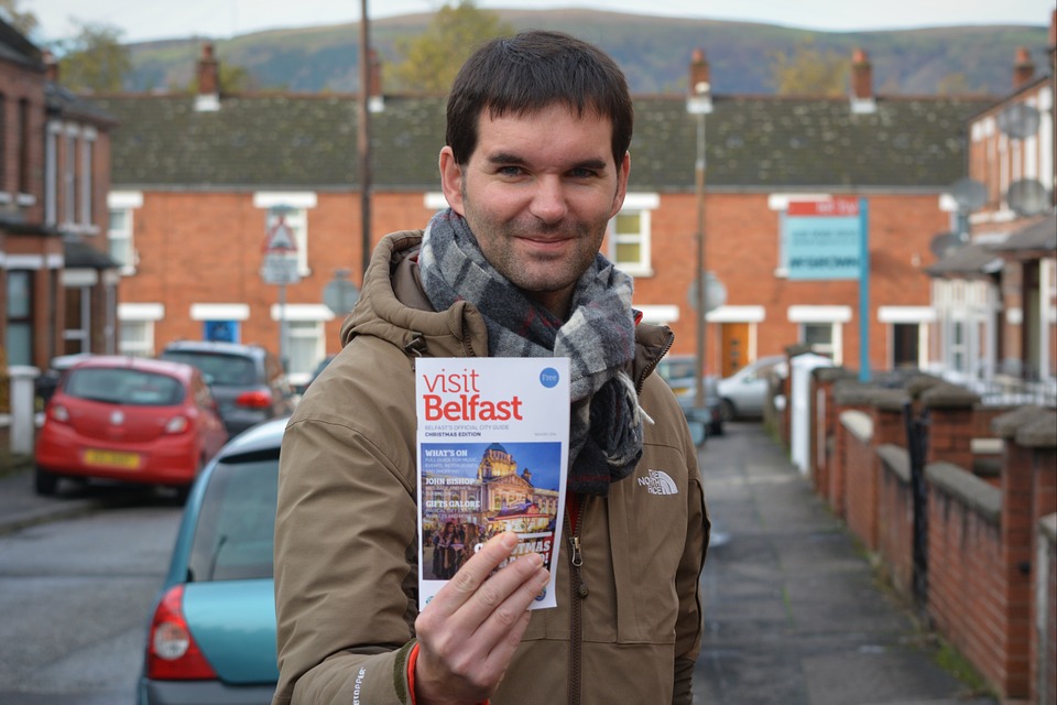a man holding a brochure