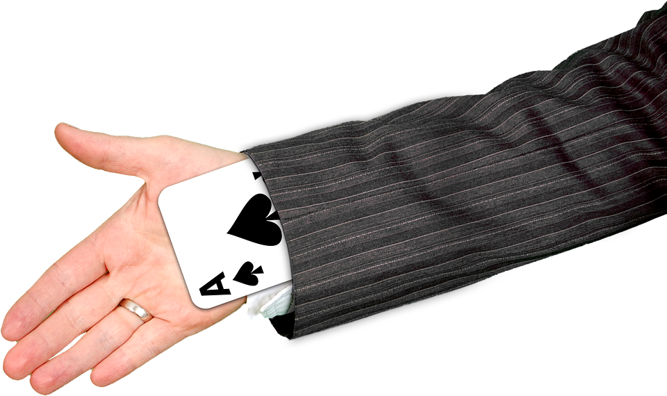 a hand with a card in the sleeve