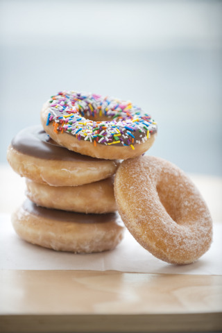 a stack of donuts with sprinkles