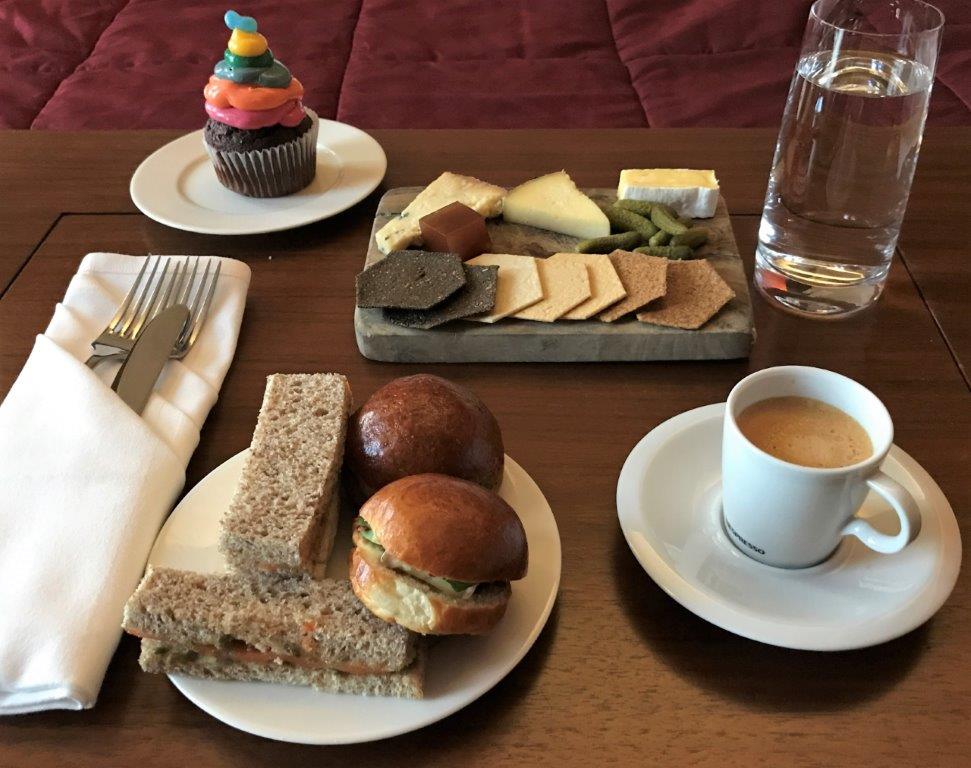a plate of food and a cup of coffee on a table