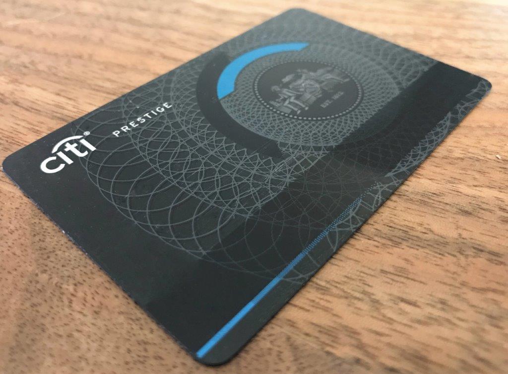 a black and blue card on a wood surface