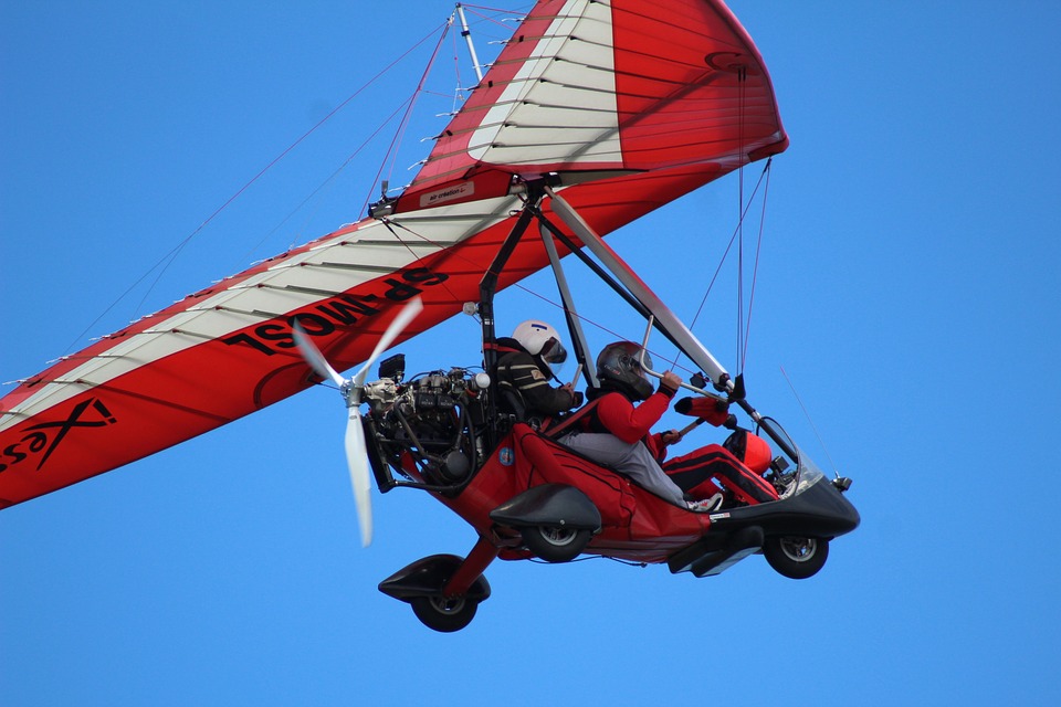 a person in a motorized airplane