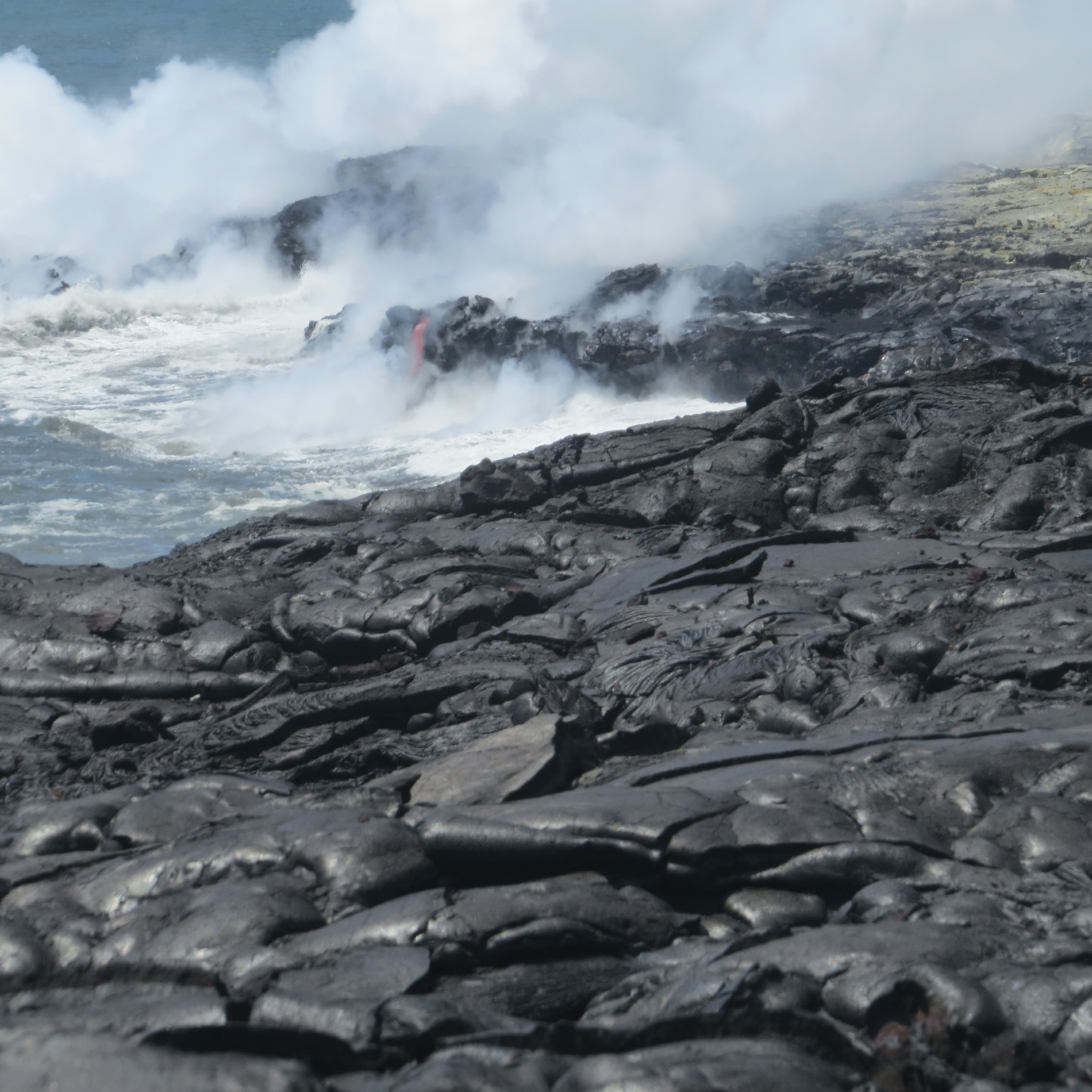 a lava flow on a rocky beach