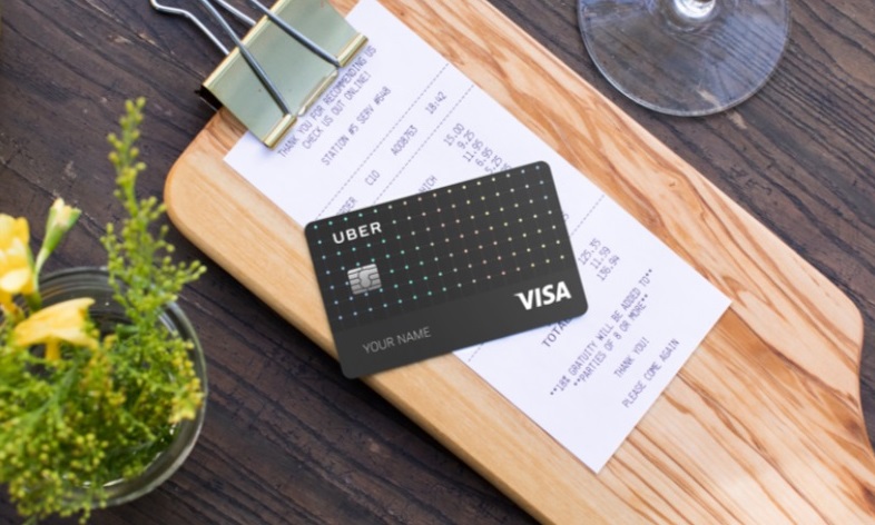 a credit card on a wood surface