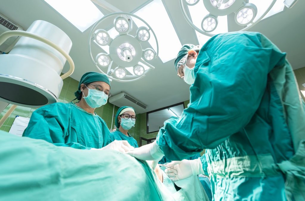 a group of surgeons in a operating room