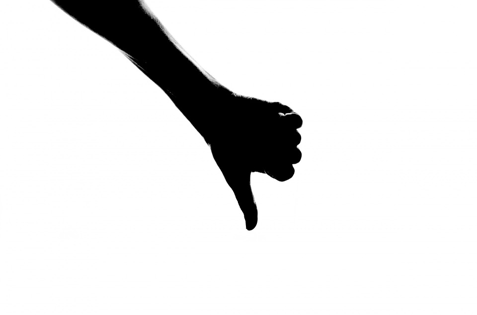 a hand with thumb down