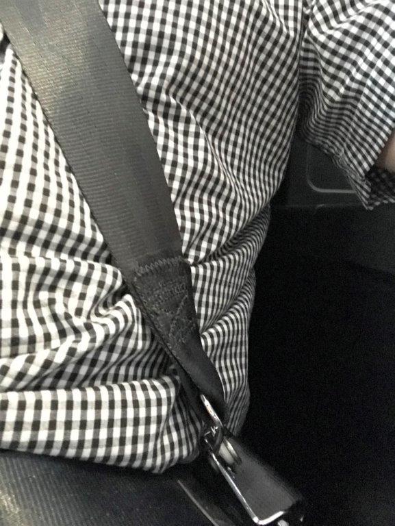 a person wearing a black and white checkered shirt