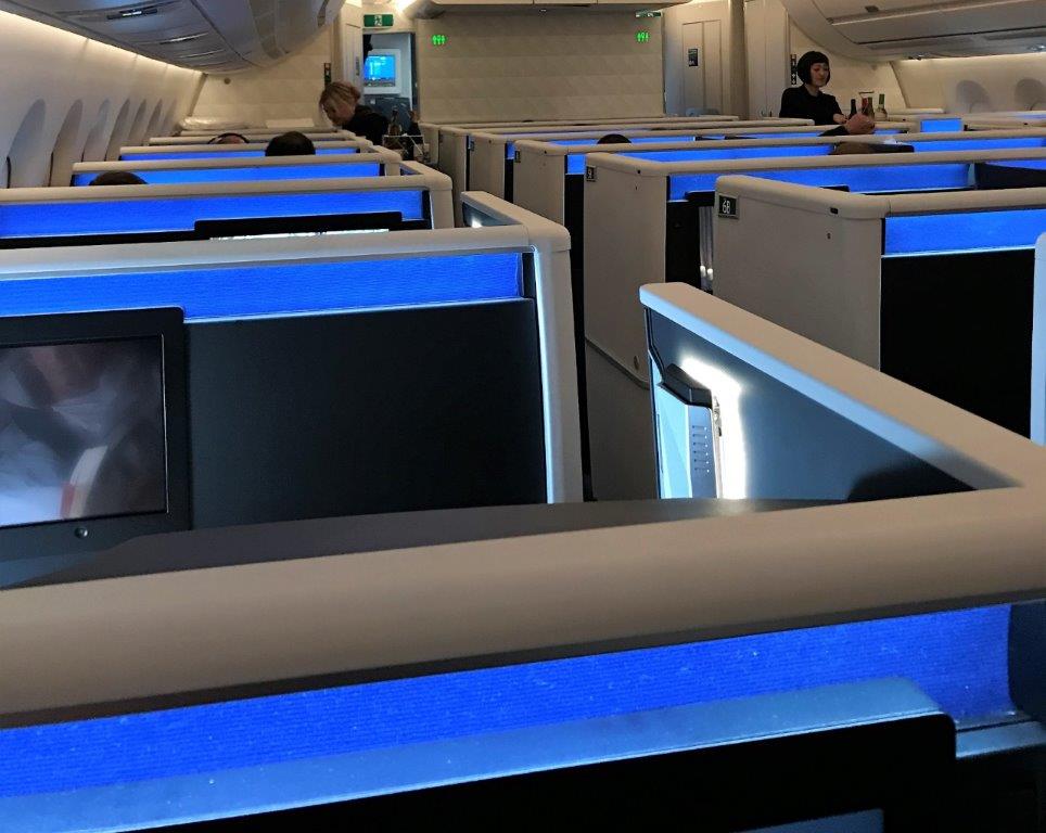 a row of seats with blue lights