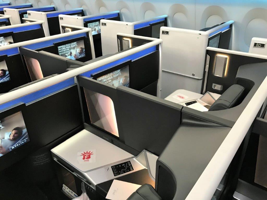 a row of seats with screens