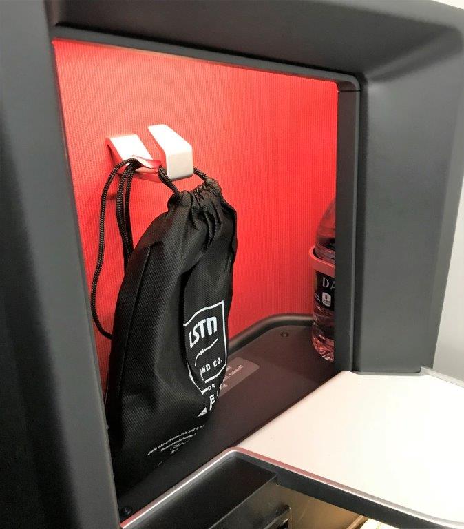 a black bag in a red wall