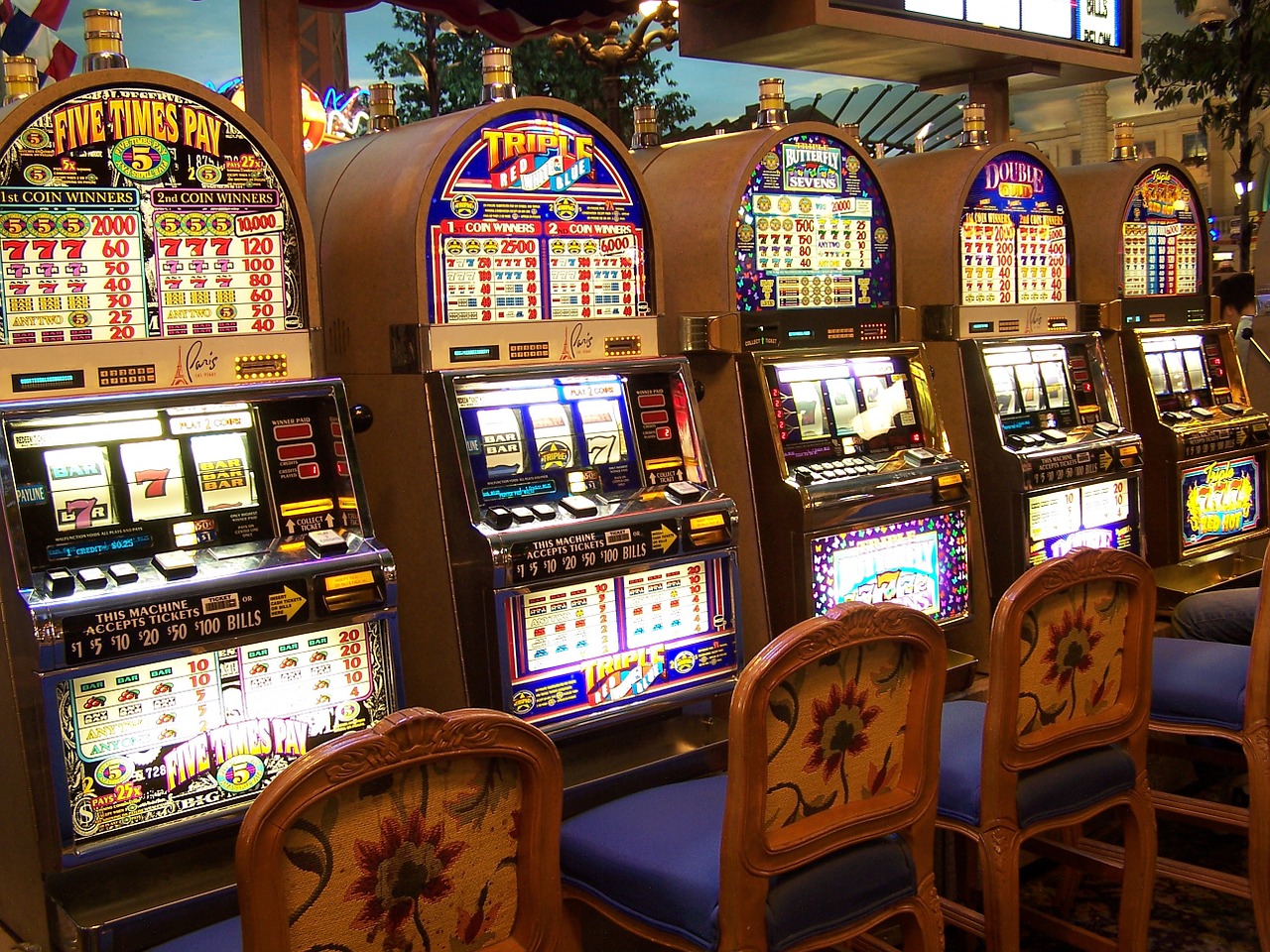 a row of slot machines in a casino