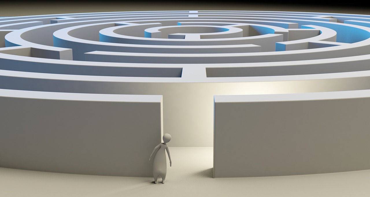 a cartoon figure standing in front of a maze