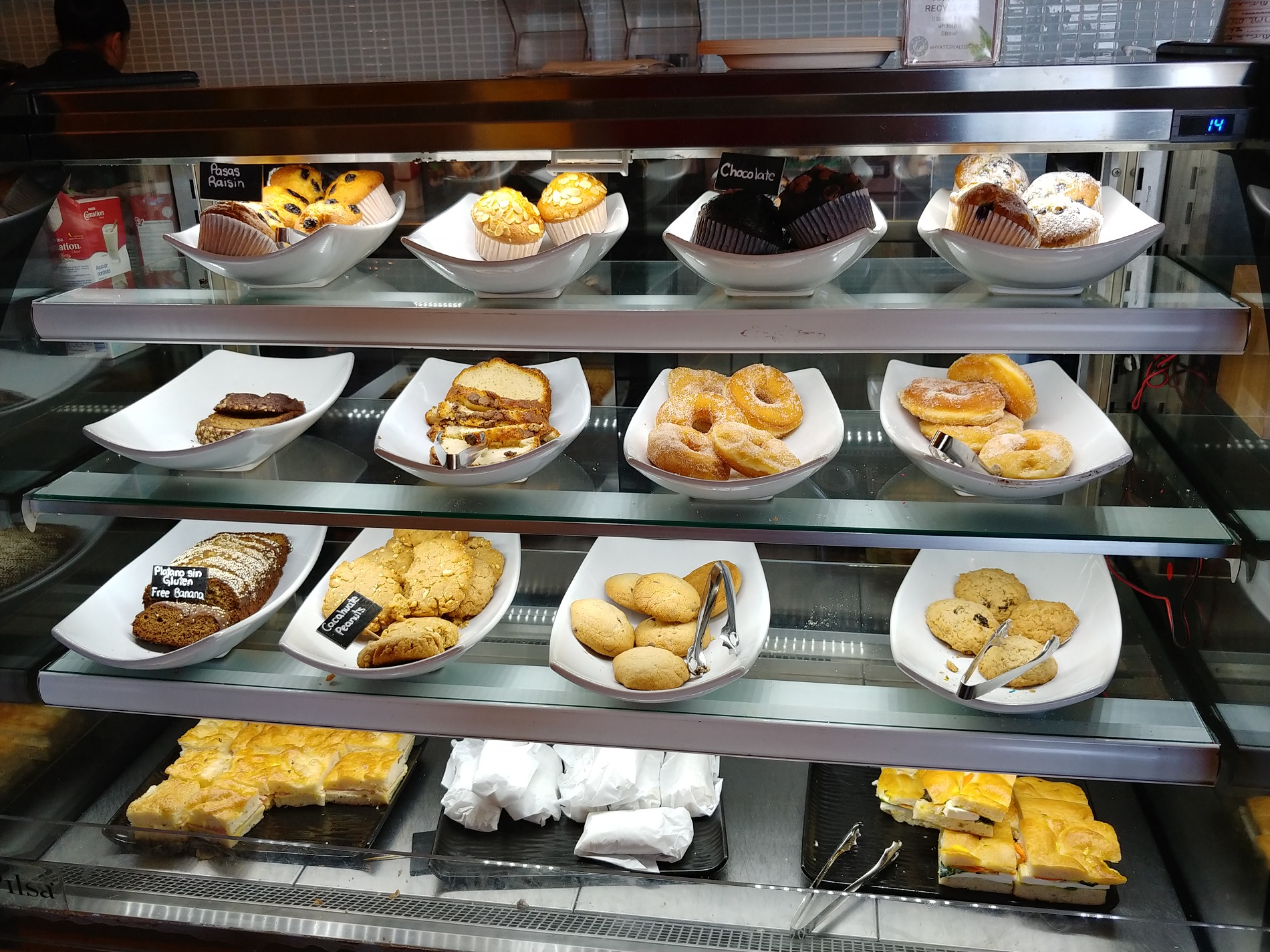 a display case with different types of pastries