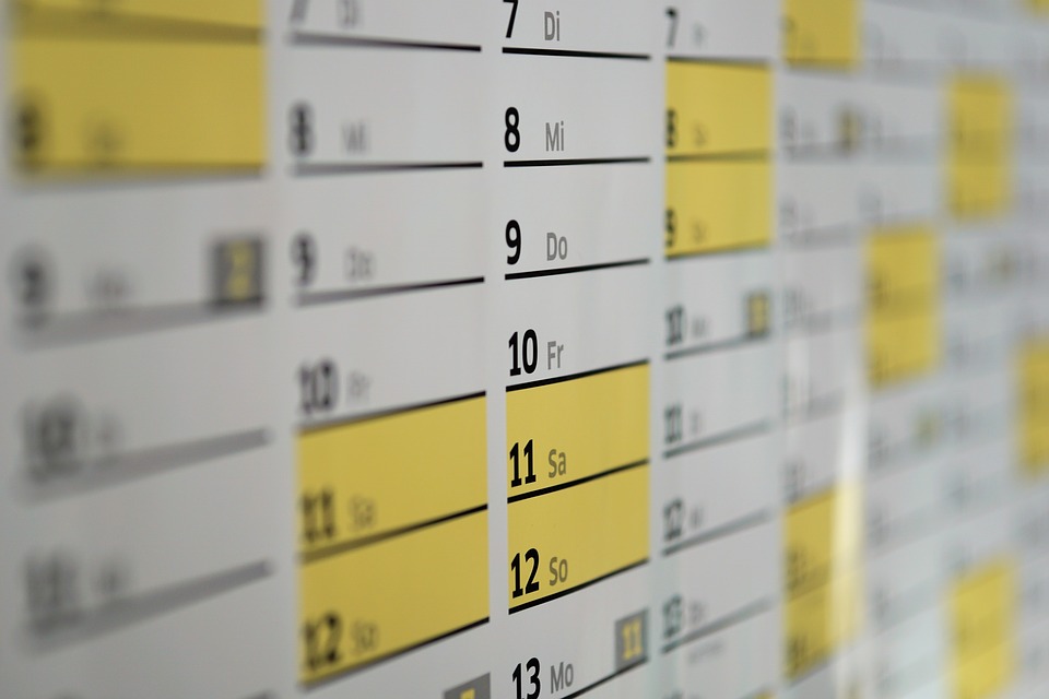 a calendar with yellow and black numbers