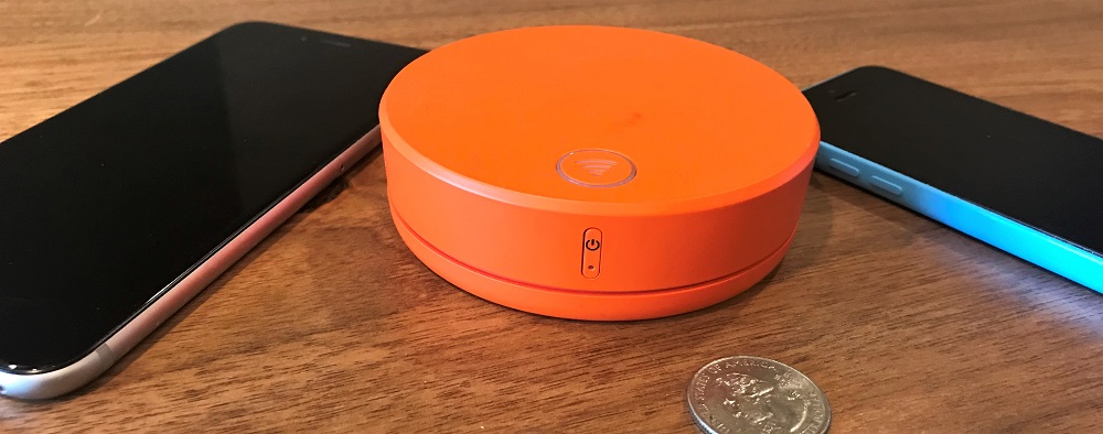 an orange circular object next to a coin