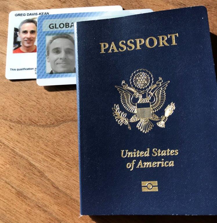 a passport and id cards on a table