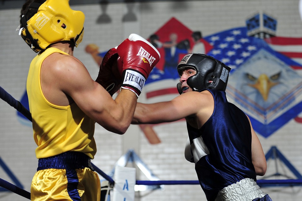 a man wearing boxing gloves and a helmet