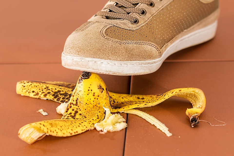 a shoe stepping on a banana peel