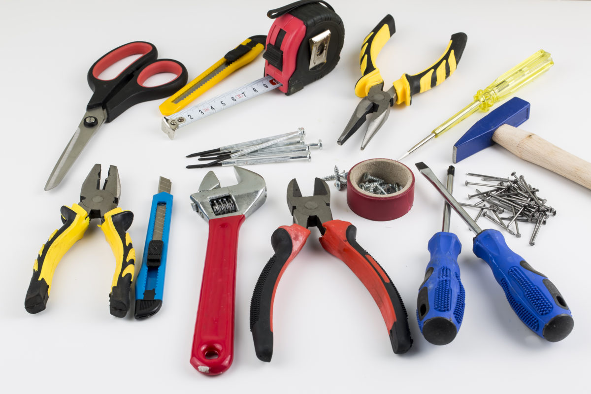 a group of tools on a white surface
