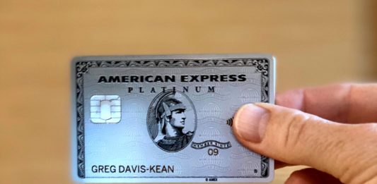 a hand holding a credit card