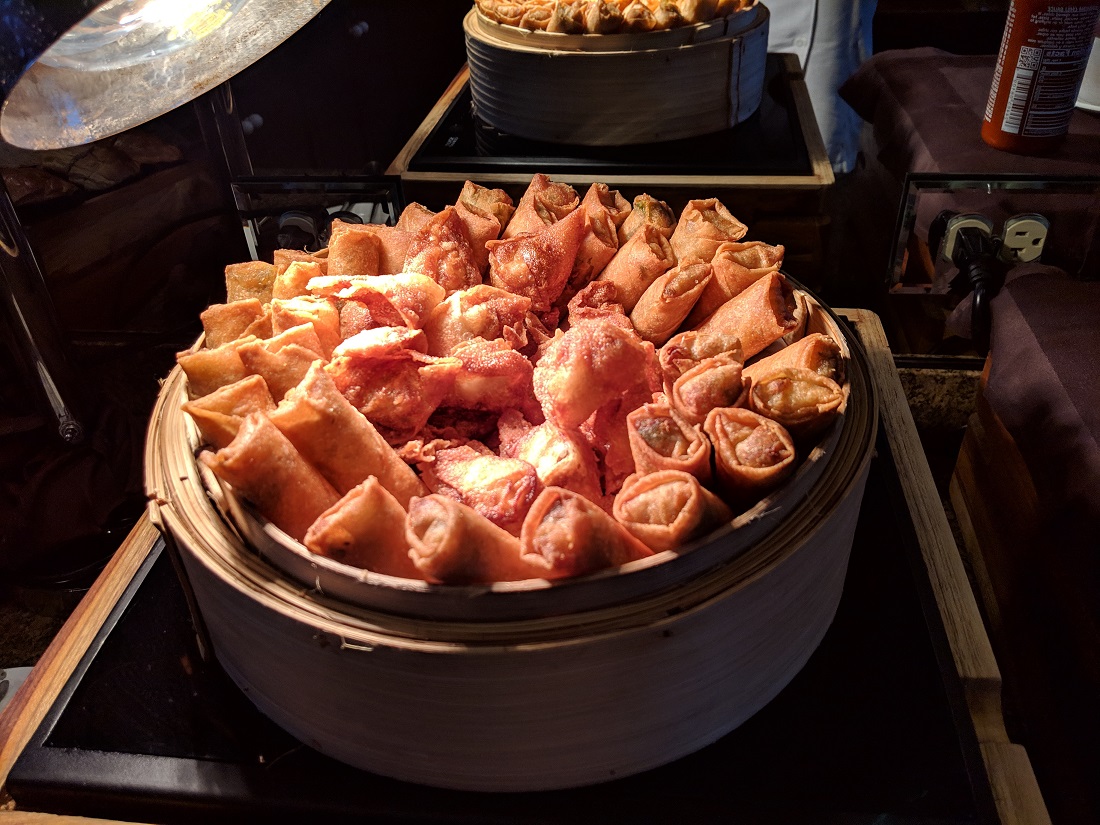 a basket of fried spring rolls