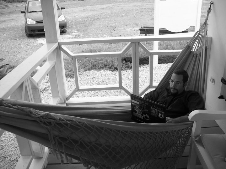 a man sitting in a hammock