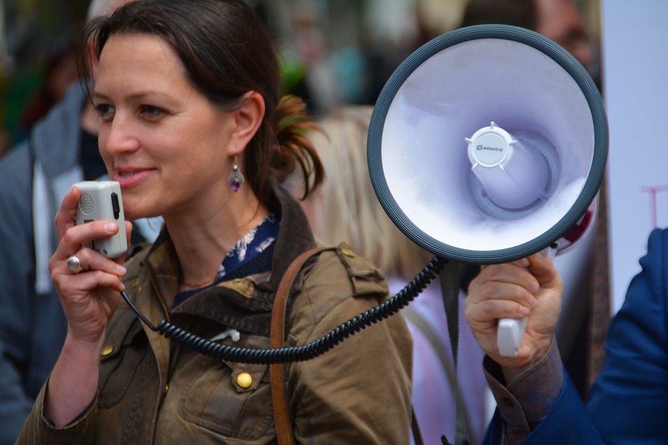 a woman holding a megaphone