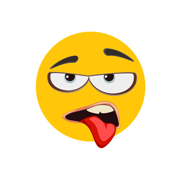 a yellow face with a tongue sticking out