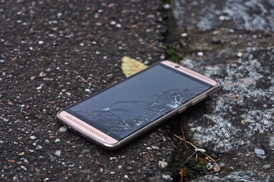 a cell phone with a broken screen