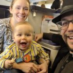 a man and woman with a baby