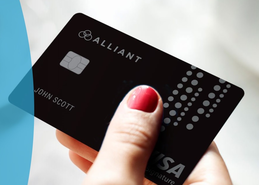 a close-up of a hand holding a credit card