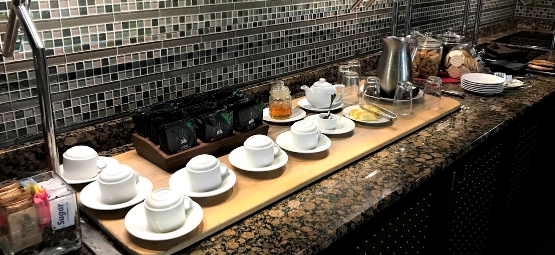 a table with tea cups and saucers
