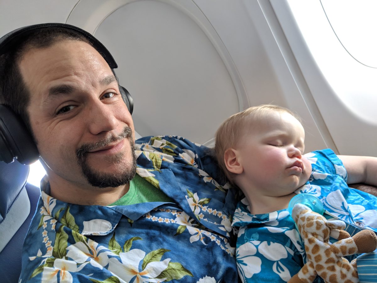 a man and baby taking a selfie
