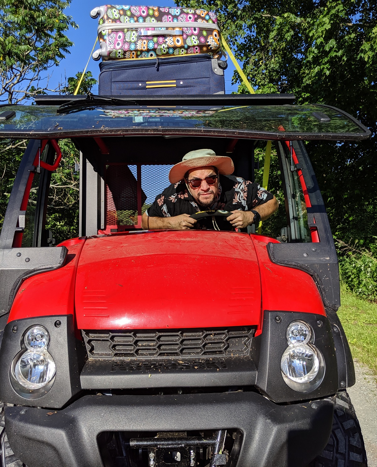 a man driving a red vehicle