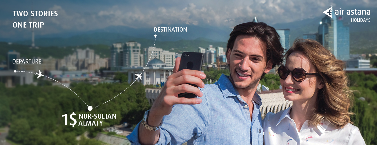 a man taking a selfie with a city in the background