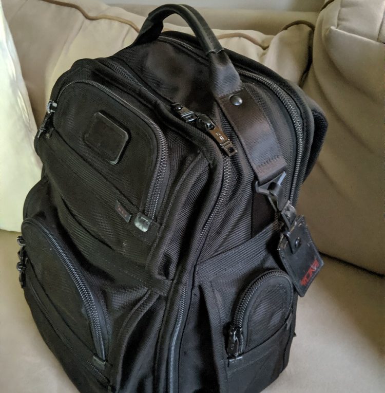 a black backpack on a couch