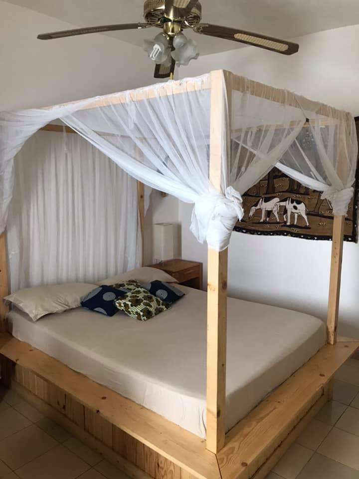 a bed with a canopy over it