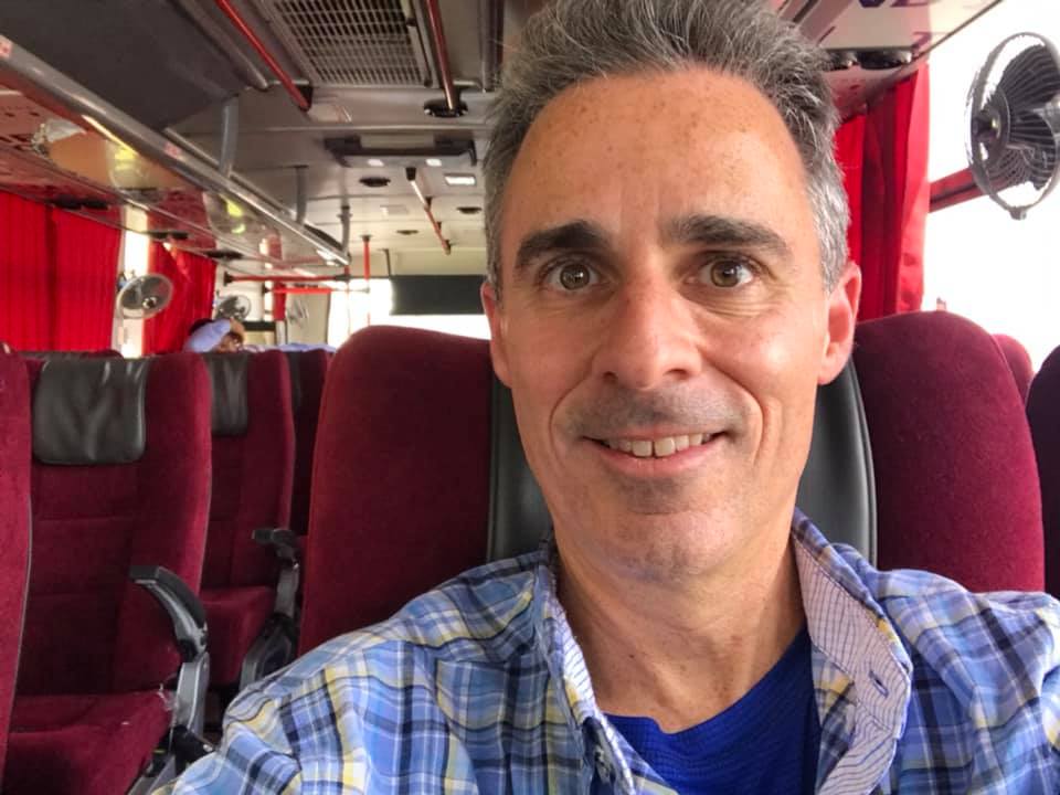 a man sitting in a bus