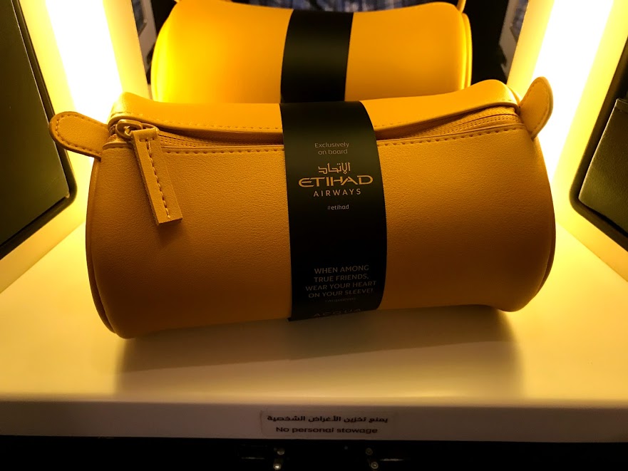 a yellow pouches with a black band