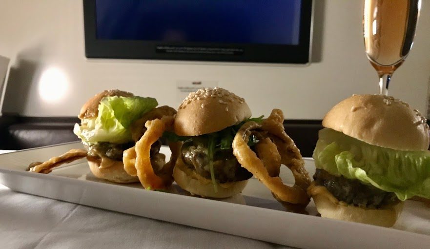 a group of burgers on a plate
