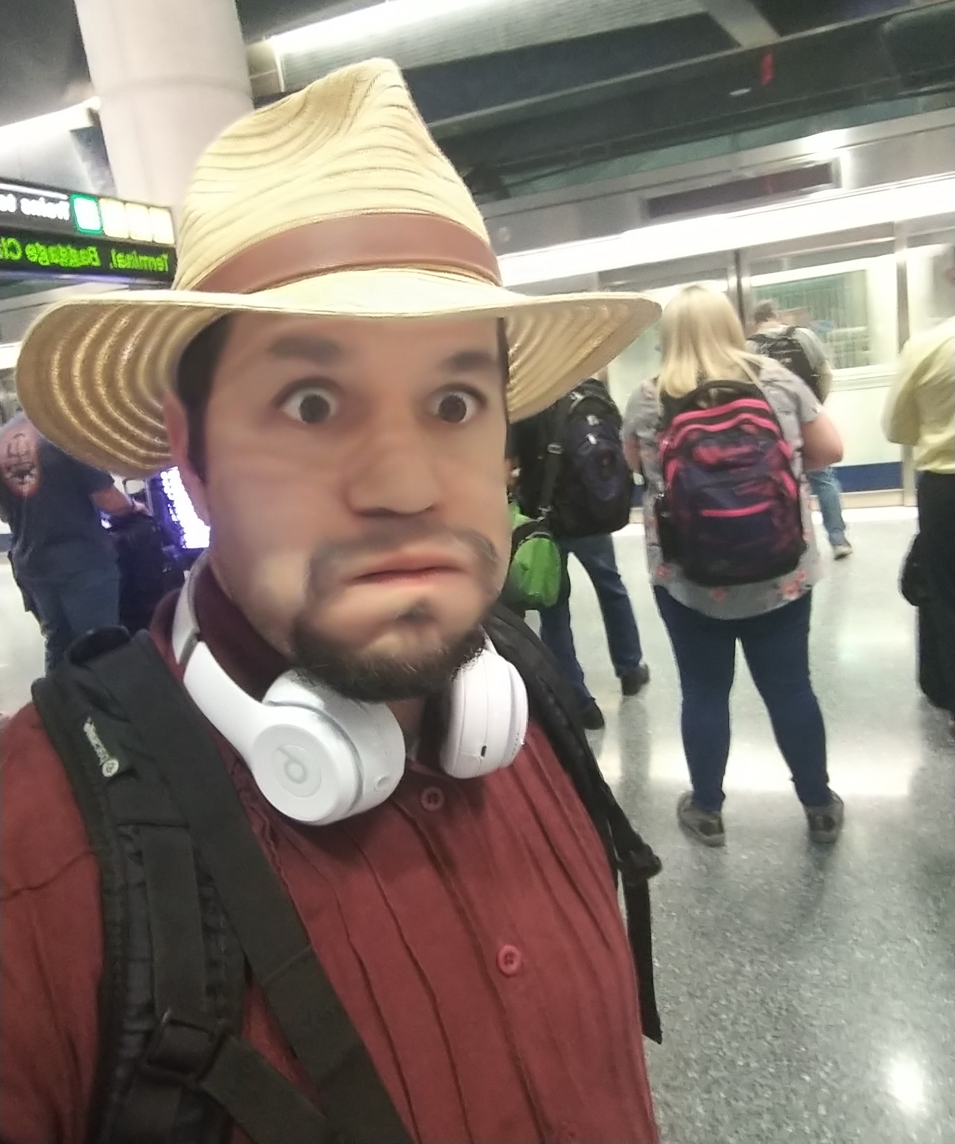 a man with a hat and headphones