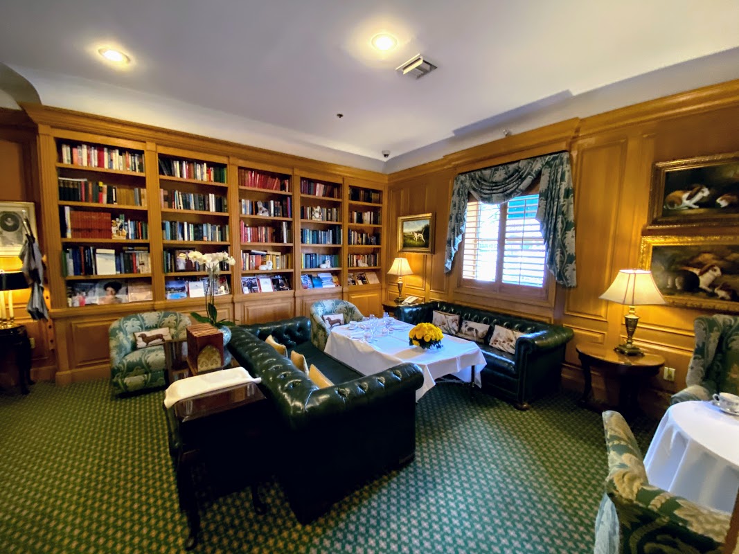 a room with a bookcase and couches