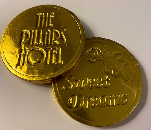 a gold coins with writing on them