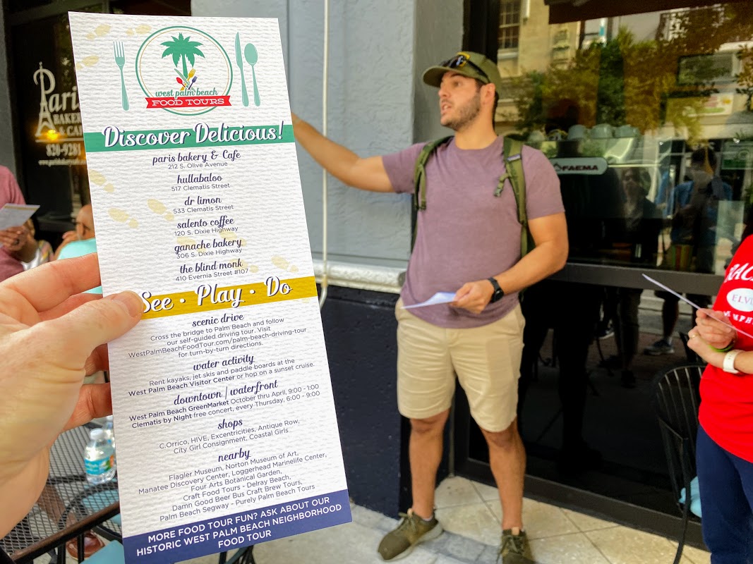 a man holding a menu