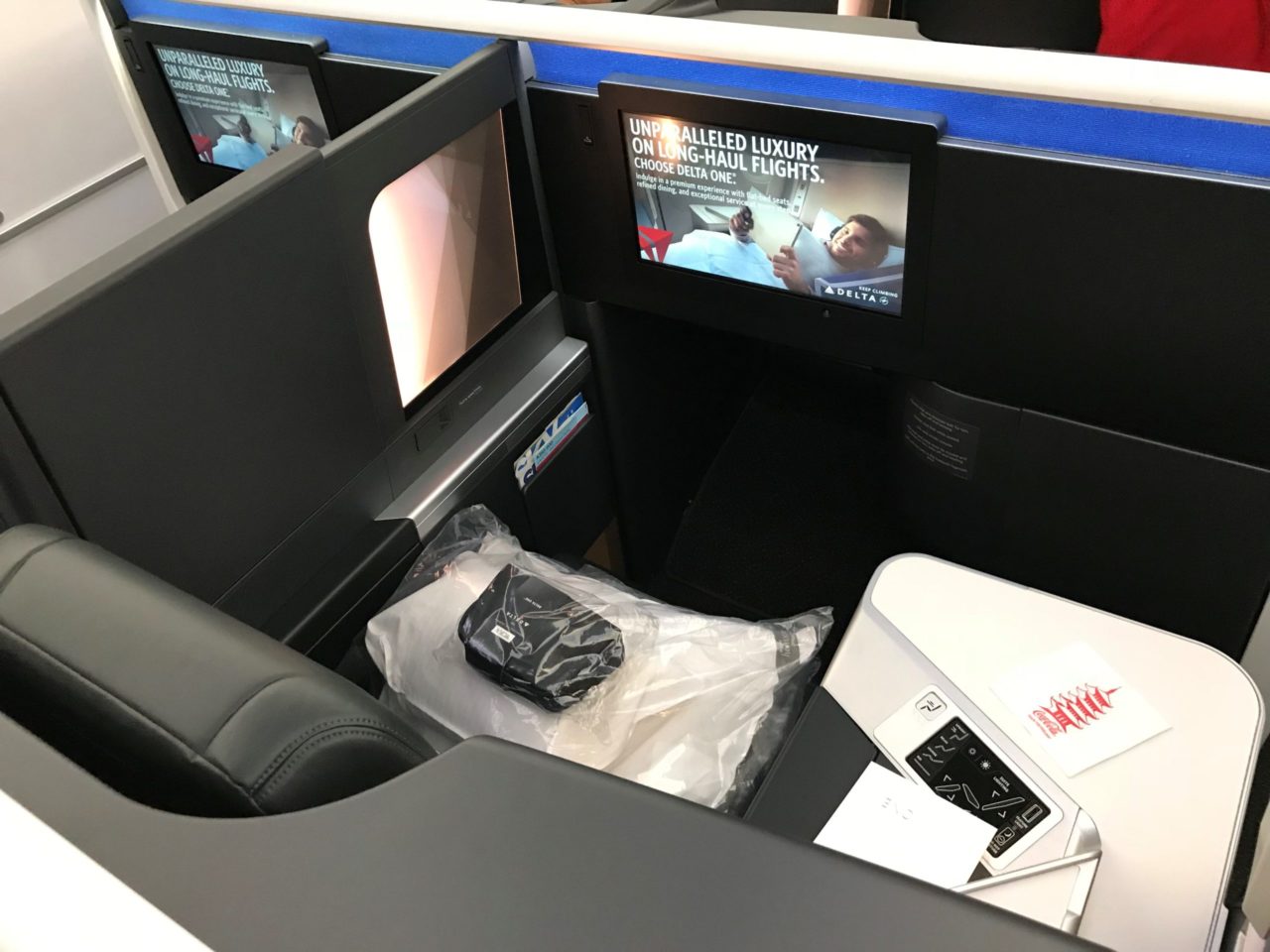 a tv and a chair in a business class
