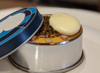 a round container with a lid on top of it